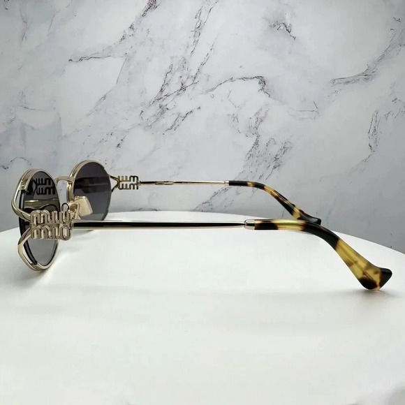 Miu Miu Gold Frame Sunglasses with Black Lenses